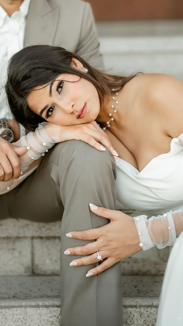 Close engagement portrait with a diamond ring in view