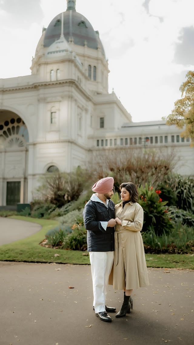 Sikh couple outside a grand historic building